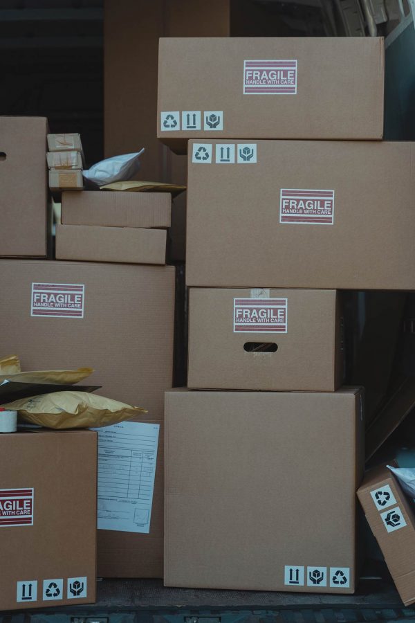 Shipping packages stacked in postal vehicle